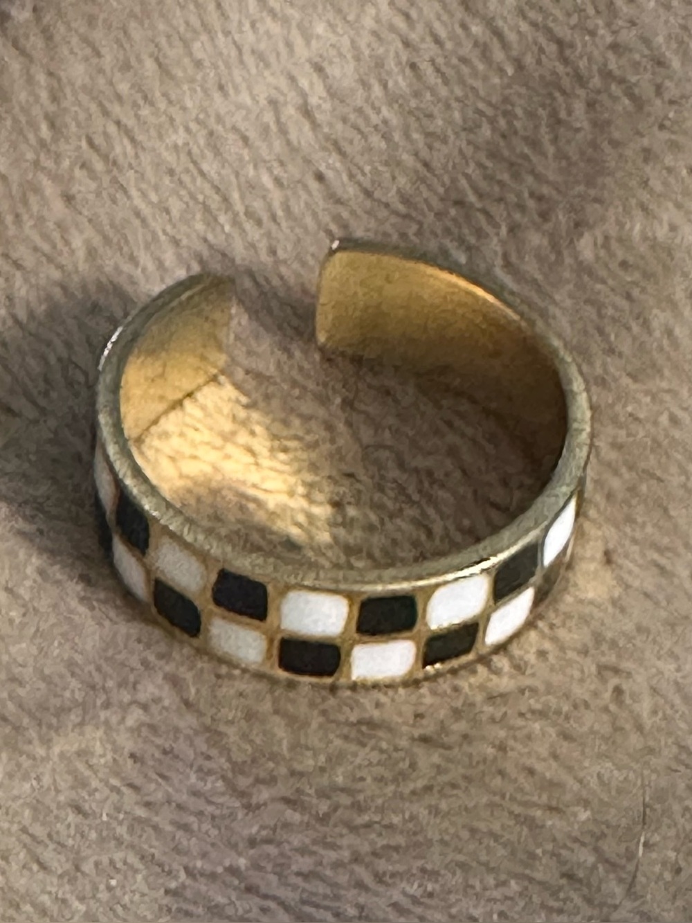 Adjustable gold tone black and white checkered ring by Lolo’s Jewelry.